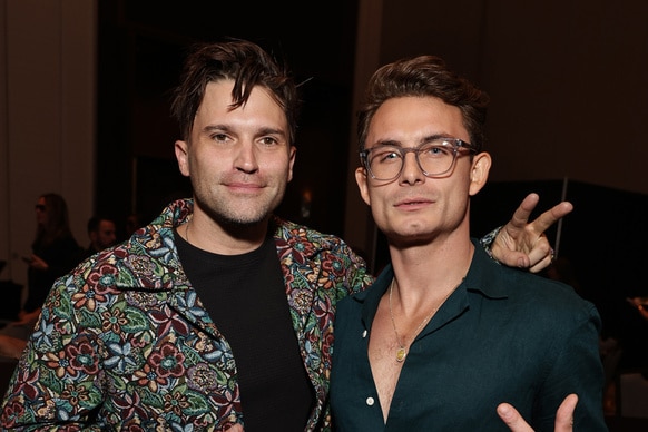Tom Schwartz and James Kennedy of Vanderpump Rules pose with peace signs